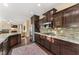 Modern kitchen features stainless steel appliances and granite countertops at 10825 Bernini Dr, Las Vegas, NV 89141