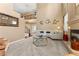 Open living room with curved sofa and fireplace at 10825 Bernini Dr, Las Vegas, NV 89141