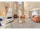 Spacious living room with a fireplace and large windows at 10825 Bernini Dr, Las Vegas, NV 89141