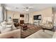 Spacious living room featuring a fireplace and ample natural light at 10825 Bernini Dr, Las Vegas, NV 89141