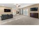 Spacious main bedroom with fireplace, large TV, and private access to bathroom at 10825 Bernini Dr, Las Vegas, NV 89141