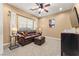 Bright office space with a comfortable leather sofa and large window at 10825 Bernini Dr, Las Vegas, NV 89141