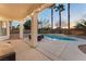Covered patio with string lights overlooking the pool at 10825 Bernini Dr, Las Vegas, NV 89141