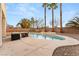 Large kidney-shaped pool with spa and patio seating at 10825 Bernini Dr, Las Vegas, NV 89141