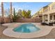Relaxing backyard with a kidney-shaped pool and spa at 10825 Bernini Dr, Las Vegas, NV 89141