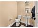 Elegant powder room with pedestal sink and dark wood flooring at 10825 Bernini Dr, Las Vegas, NV 89141