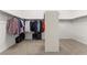 Large walk-in closet with ample hanging space and shelving at 10825 Bernini Dr, Las Vegas, NV 89141