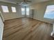 Spacious bedroom with ceiling fan, walk-in closet, and wood-look floors at 11660 Fiorello Ct, Las Vegas, NV 89183
