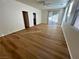 Bright living room featuring wood-look floors and sliding glass doors at 11660 Fiorello Ct, Las Vegas, NV 89183
