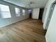 Living room with wood-look floors and a staircase at 11660 Fiorello Ct, Las Vegas, NV 89183