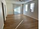 Spacious living room with wood-look floors and neutral walls at 11660 Fiorello Ct, Las Vegas, NV 89183