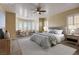 Spacious main bedroom with bay window, plush carpet, and neutral tones at 12237 Olivetta Ct, Las Vegas, NV 89138