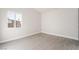 Bright bedroom with light gray vinyl flooring and a window offering natural light at 1720 Hassett Ave, Las Vegas, NV 89104