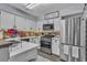 Updated kitchen featuring white cabinets and quartz countertops at 2121 Willowbury Dr # A, Las Vegas, NV 89108