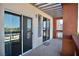 Spacious balcony with glass railings and an open trellis covering at 23 E Agate Ave # 506, Las Vegas, NV 89123