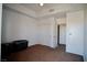 Bedroom with carpet floors, closet, and access to additional rooms at 23 E Agate Ave # 506, Las Vegas, NV 89123