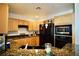 This kitchen has stainless steel appliances, granite counters, and wooden cabinets at 23 E Agate Ave # 506, Las Vegas, NV 89123