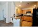 Well-lit kitchen with granite countertops and wooden cabinets at 23 E Agate Ave # 506, Las Vegas, NV 89123