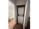 This laundry area features a stacked washer and dryer and is located near the bathroom at 23 E Agate Ave # 506, Las Vegas, NV 89123