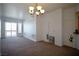 A spacious, light-filled living room with sliding glass doors to the balcony at 23 E Agate Ave # 506, Las Vegas, NV 89123