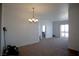 Large living room with natural light and carpet at 23 E Agate Ave # 506, Las Vegas, NV 89123