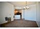 Open living space featuring a kitchen and cozy carpet at 23 E Agate Ave # 506, Las Vegas, NV 89123