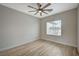 Spacious bedroom with ceiling fan and wood-look floors at 2603 Savannah Springs Ave, Henderson, NV 89052