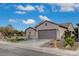 Single-story home with two-car garage and desert landscaping at 2603 Savannah Springs Ave, Henderson, NV 89052