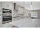 Stainless steel appliances and white shaker cabinets in kitchen at 2603 Savannah Springs Ave, Henderson, NV 89052