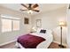 Bedroom with a double bed, ceiling fan, and large window at 2755 Sunken Ship St, Laughlin, NV 89029