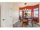 Round dining table with seating for four and red walls at 2755 Sunken Ship St, Laughlin, NV 89029