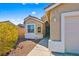 Front door and walkway with desert landscaping at 2755 Sunken Ship St, Laughlin, NV 89029