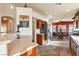 Open kitchen boasts a breakfast bar, stainless steel appliances, and dark wood cabinets at 2755 Sunken Ship St, Laughlin, NV 89029