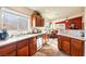 Kitchen with wood cabinets, stainless steel appliances, and tile floors at 2755 Sunken Ship St, Laughlin, NV 89029