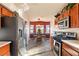 Bright kitchen features a breakfast nook, stainless steel appliances, and wood cabinets at 2755 Sunken Ship St, Laughlin, NV 89029