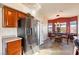 Kitchen with wood cabinets, stainless steel appliances, and tile floors at 2755 Sunken Ship St, Laughlin, NV 89029