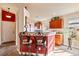 Kitchen features a breakfast bar, dark wood cabinets, and a view into the living area at 2755 Sunken Ship St, Laughlin, NV 89029