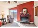 Living room features a fireplace, comfortable seating, and sliding glass doors to the backyard at 2755 Sunken Ship St, Laughlin, NV 89029