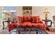 Living room with comfortable seating, end tables, and a large piece of artwork at 2755 Sunken Ship St, Laughlin, NV 89029