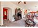 Open living room with a large TV stand, comfortable seating, and views into the kitchen at 2755 Sunken Ship St, Laughlin, NV 89029