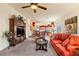 Spacious living room with comfortable seating, a large TV stand, and a view into the kitchen at 2755 Sunken Ship St, Laughlin, NV 89029