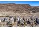 Aerial view of homes with solar panels and mountain backdrop at 30 Hilltop Crest St, Henderson, NV 89011