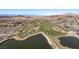 Aerial view of a golf course and lake at 30 Hilltop Crest St, Henderson, NV 89011