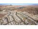Aerial view of community with lake and mountain views at 30 Hilltop Crest St, Henderson, NV 89011