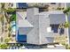 An aerial view of the property showcasing the roof, backyard pool, and landscaping at 30 Hilltop Crest St, Henderson, NV 89011