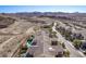 Aerial view of neighborhood with homes and desert landscape at 30 Hilltop Crest St, Henderson, NV 89011