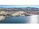 Aerial view of lakefront homes and a golf course at 30 Hilltop Crest St, Henderson, NV 89011