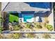 Aerial view of backyard oasis with pool, artificial turf, and grilling station at 30 Hilltop Crest St, Henderson, NV 89011