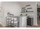 Stylish bar area featuring a granite countertop, floating shelves, and comfortable seating for entertaining at 30 Hilltop Crest St, Henderson, NV 89011