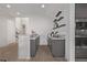 Modern bar area with sleek cabinetry, granite countertops, floating shelves, and stainless steel appliances at 30 Hilltop Crest St, Henderson, NV 89011
